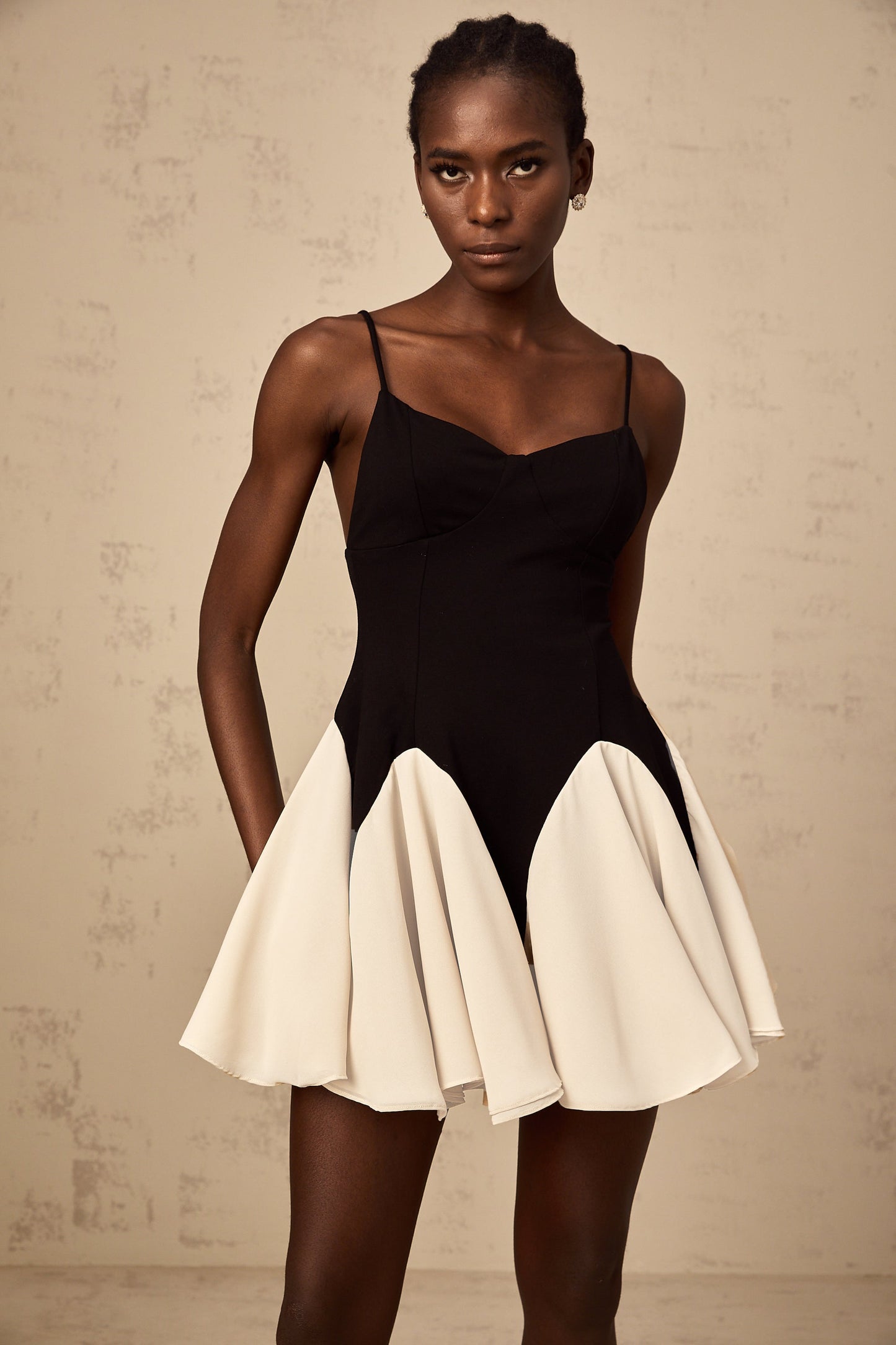 Justine color-blocked godet pleated mini dress