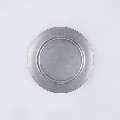Vintage INOX round stainless steel plate with chic design, ideal for versatile use.