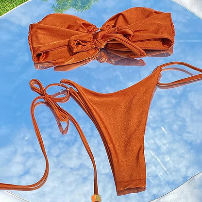 Women’s micro bikini in solid black with bandeau top and tie-up design.