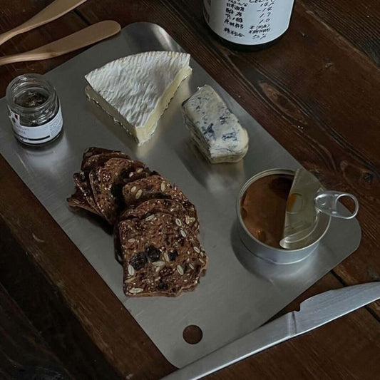 Minimalist SUS 316 stainless steel cutting board with sophisticated design, ideal for serving and display, dishwasher safe.