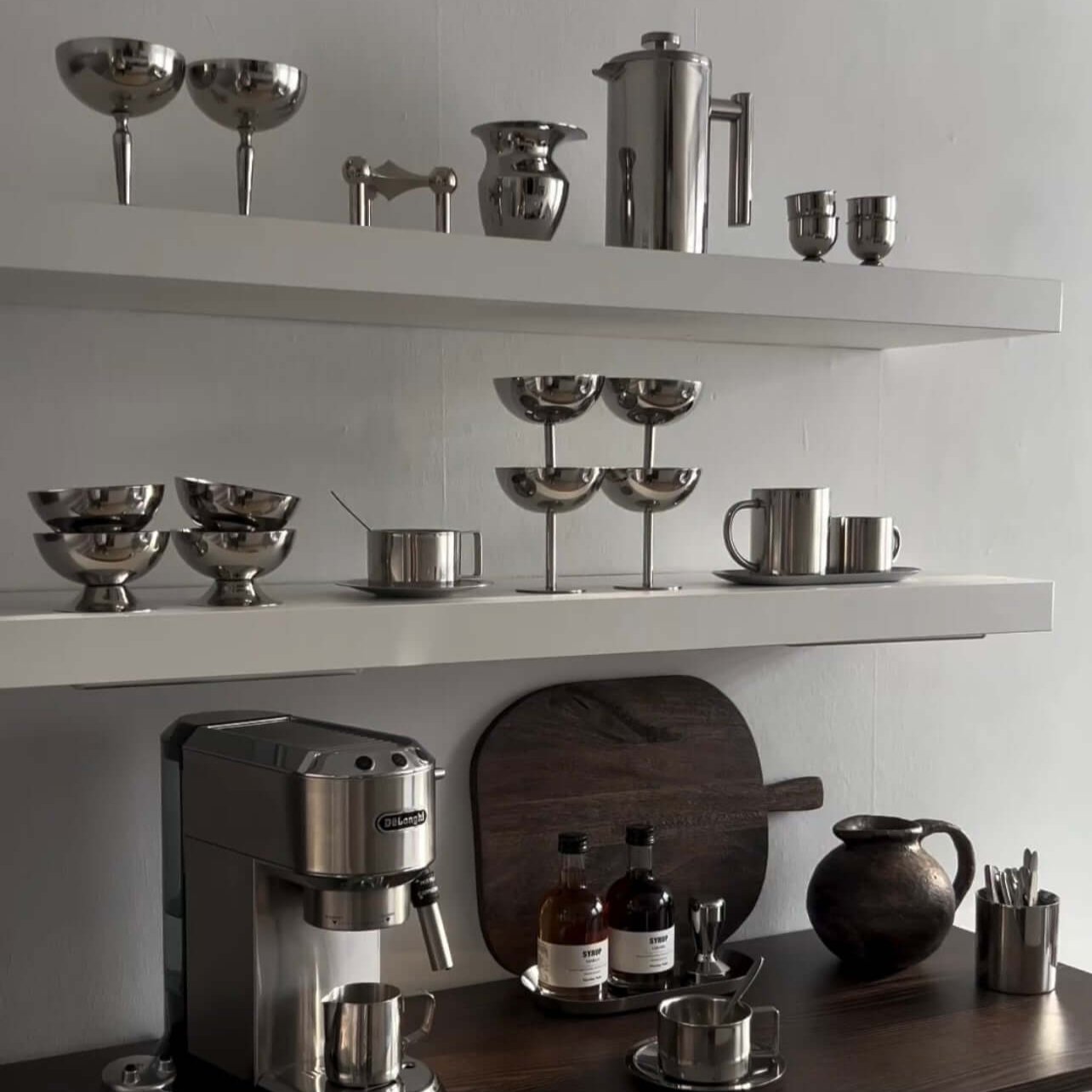 Stainless steel ice cream cups, one displayed with a perfume bottle, showcasing minimalist elegance and premium design.